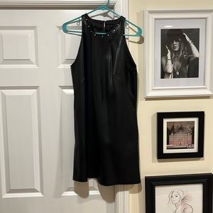 Black dress like leather but polyester I think. Women’s large. Zara Basic.